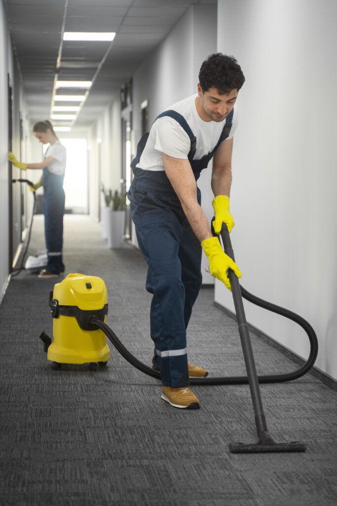 full shot people cleaning building